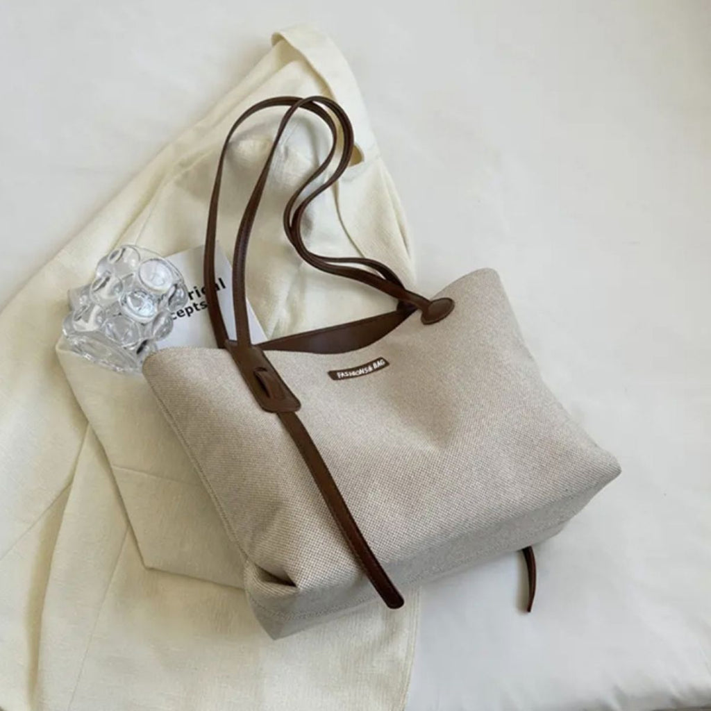 Bolso de hombro de lona con detalles de piel