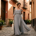 Lorena - Vestido maxi fluido sin mangas con escote asimétrico